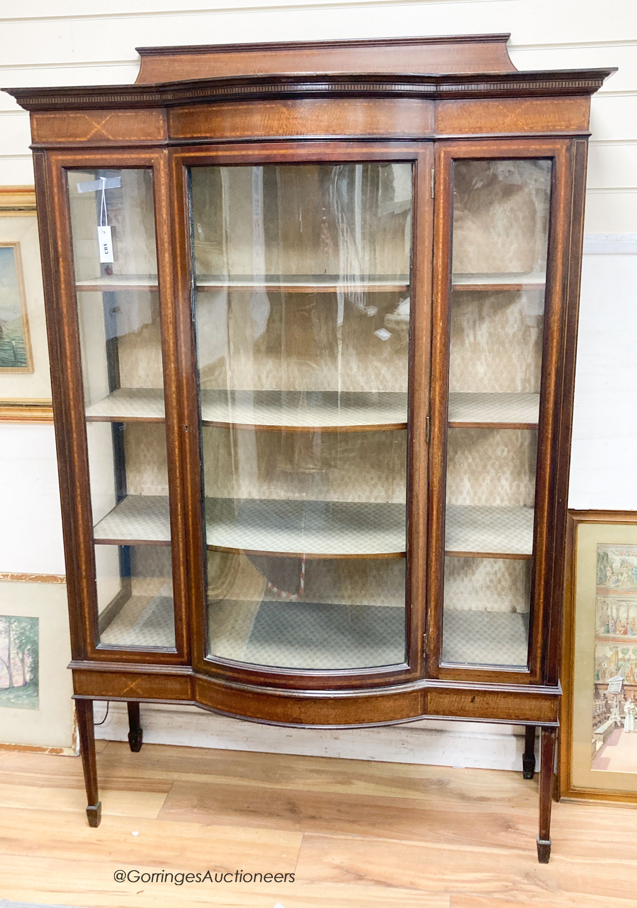 An Edwardian satinwood banded bow front mahogany display cabinet, width 115cm, depth 45cm, height 178cm